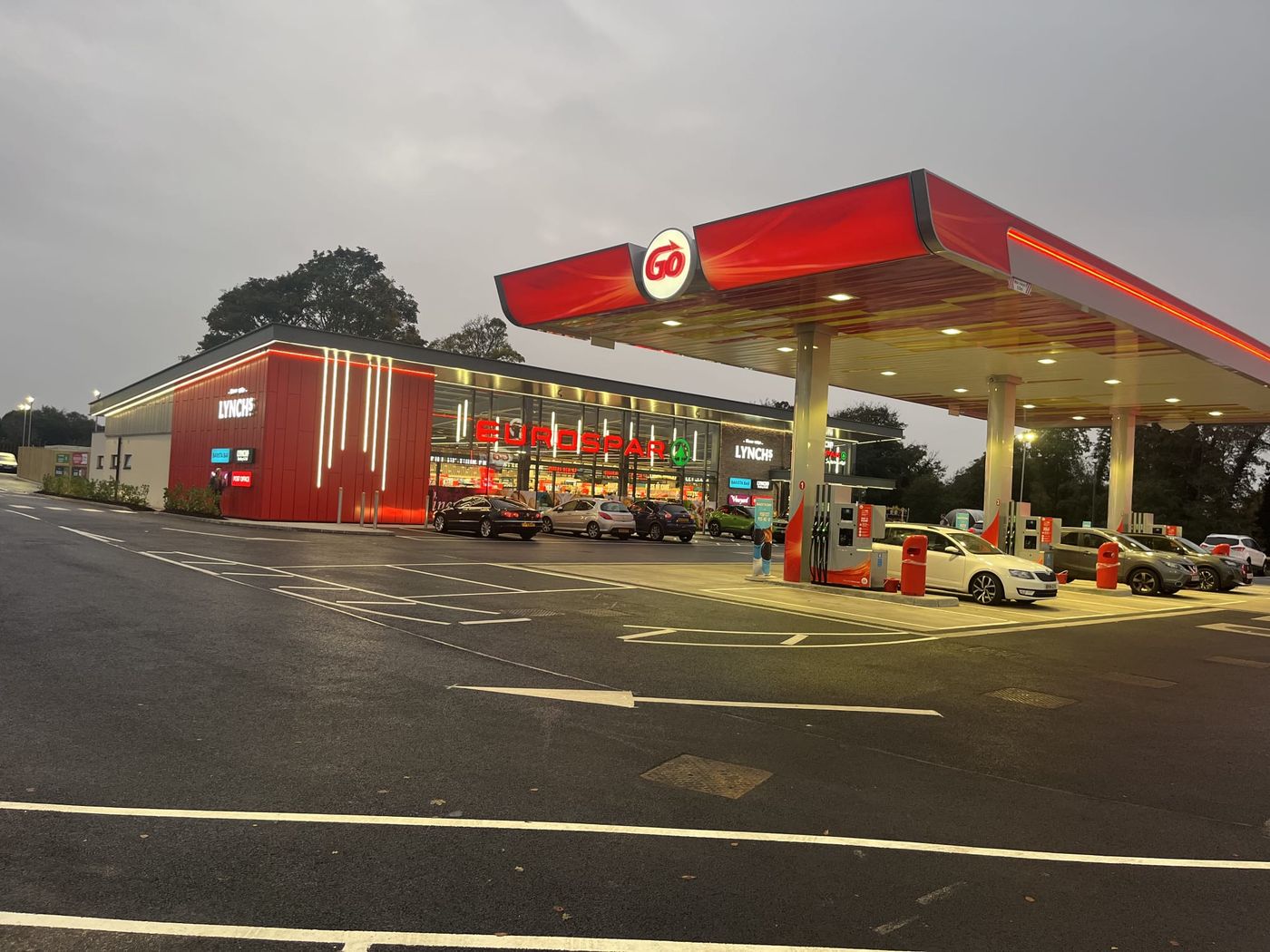 Lynch's SPAR forecourt at dusk, showing the completed cladding and canopy lighting