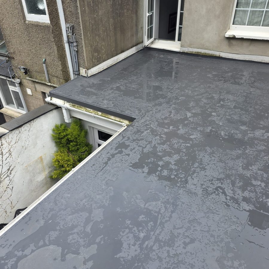 Finished flat roof with fully welded PVC membrane